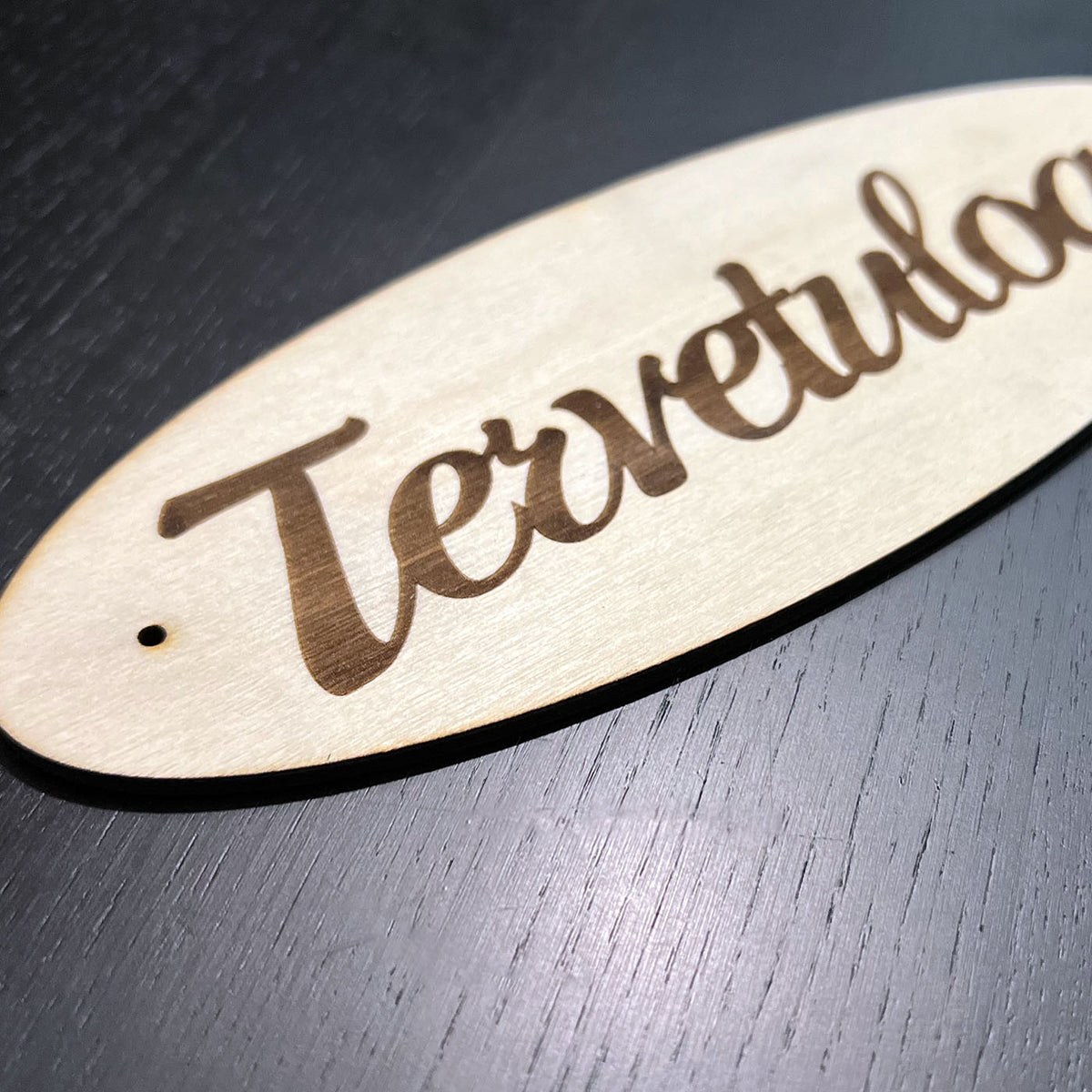 Tervetuloa kyltti oveen