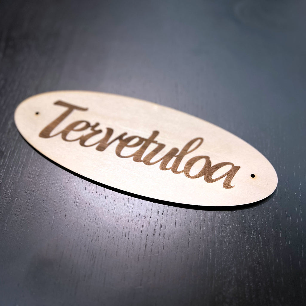 Tervetuloa kyltti oveen